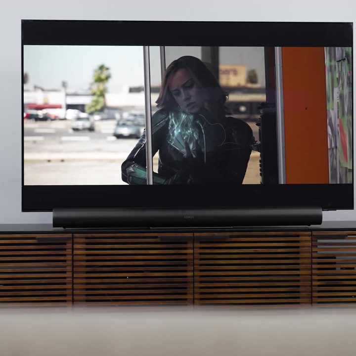 The Sonos Era 300 soundbar under a TV on a media console.