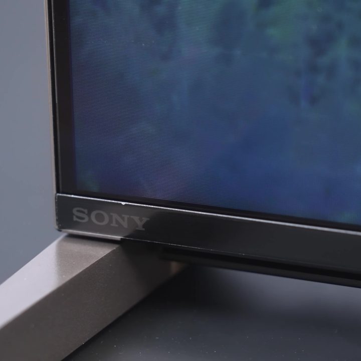 The bottom corner and stand of a Sony Bravia X93L Mini-LED TV.