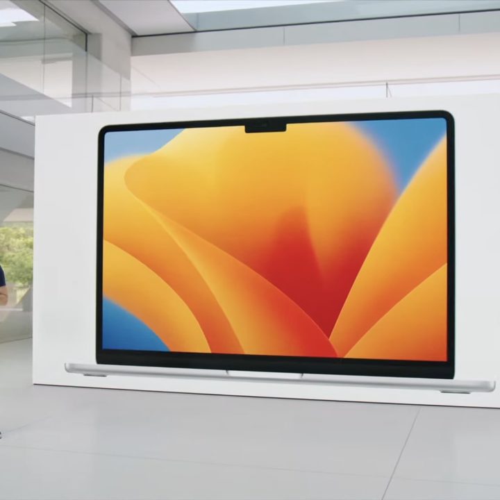 Apple's John Ternus stands next to an image of the 15-inch MacBook Air at Apple's Worldwide Developers Conference (WWDC) in June 2023.