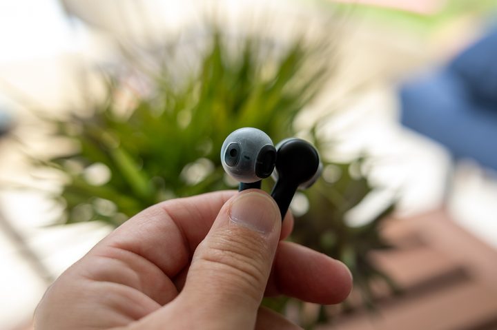 The Amazon Echo Buds 2023 in hand.