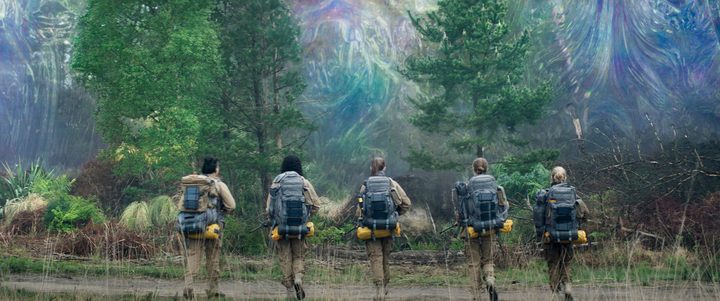 5 women walk toward a forest in Annihilation.