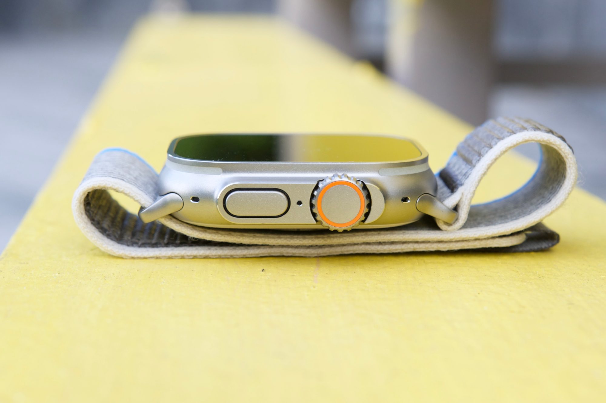 Side view of the Apple Watch Ultra, showing its Digital Crown and side button.