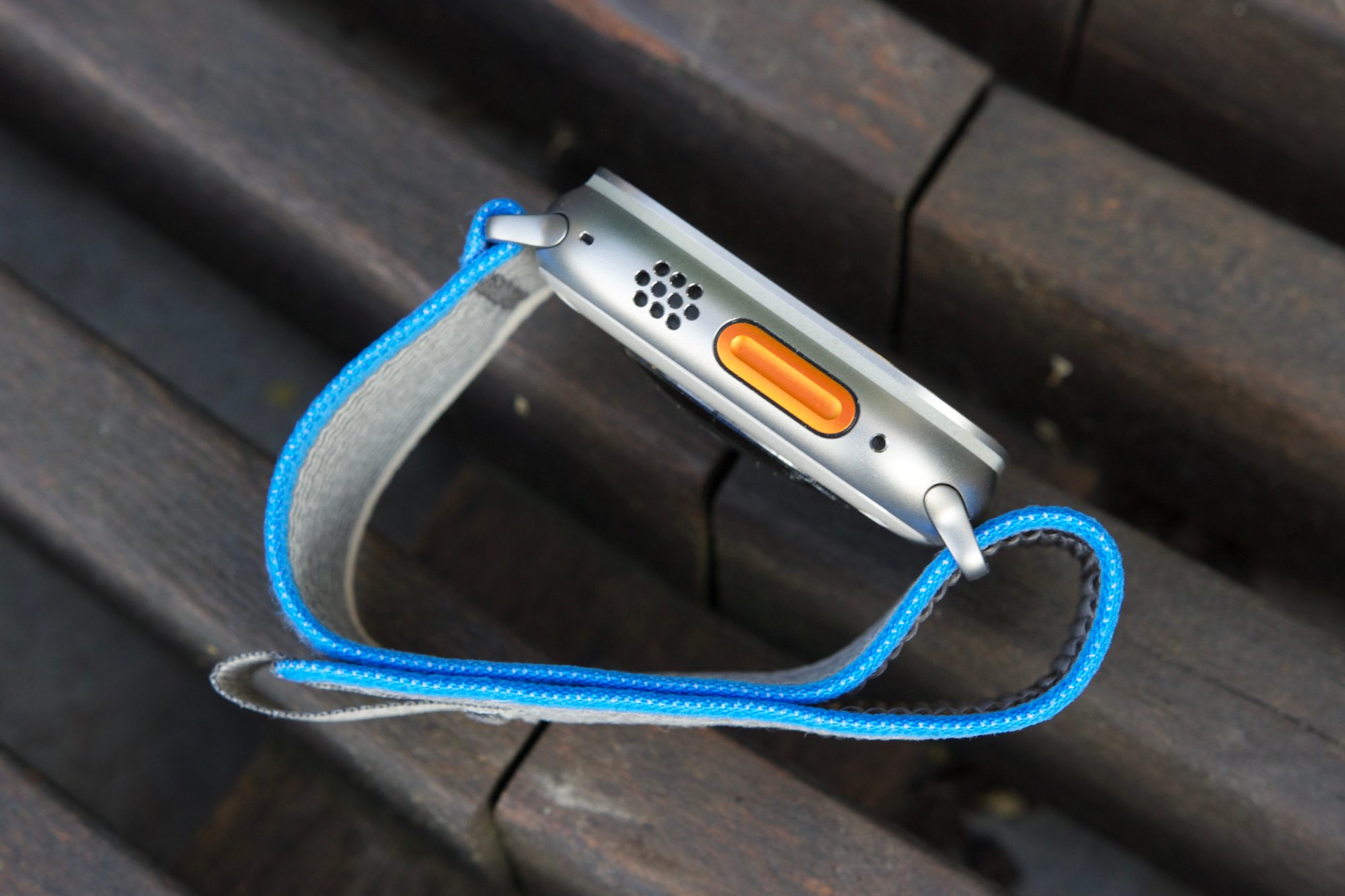 Side view of the Apple Watch Ultra, showing the orange Action Button.