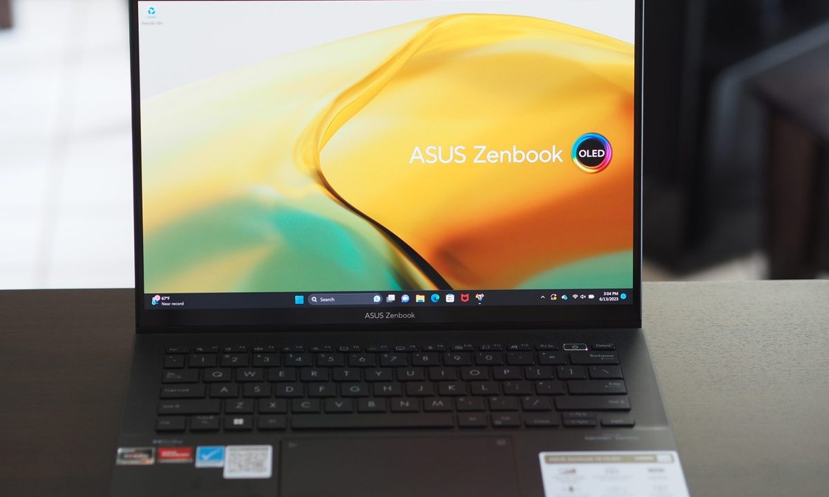 Asus Zenbook 14 OLED front view showing display and keyboard deck.
