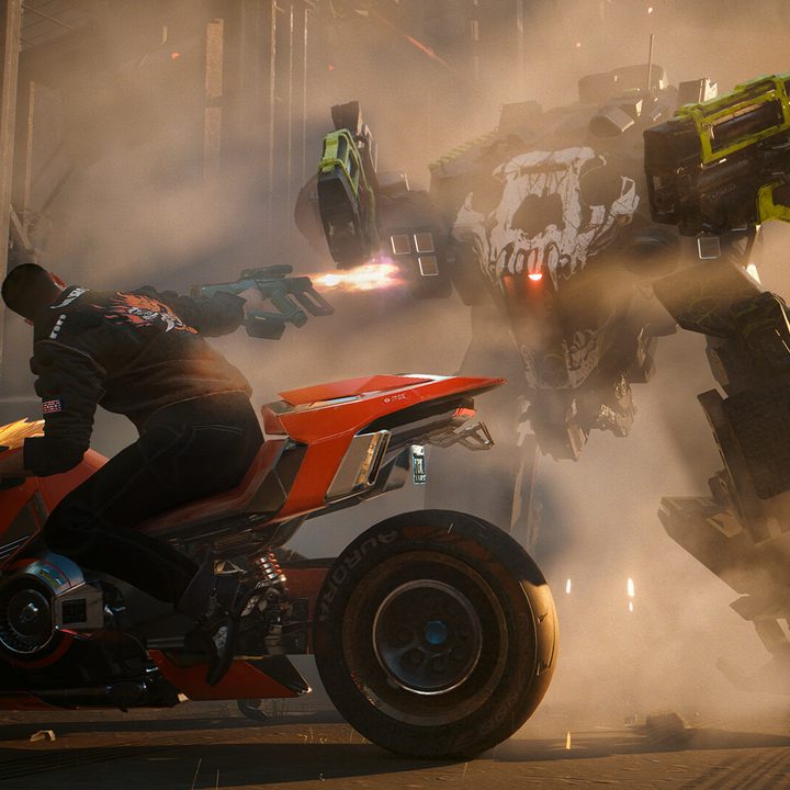 V rides a motorcycle while shooting at a mech in Cyberpunk 2077: Phantom Liberty.