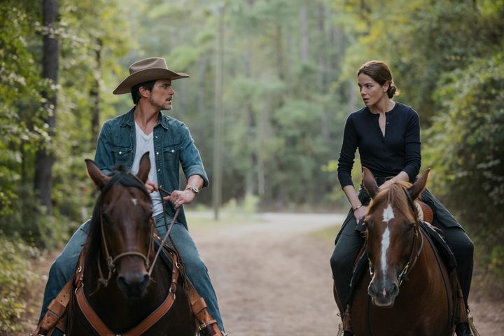 Two people sit on horses in Echoes.