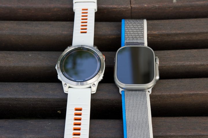 Garmin Fenix 7 Pro and Apple Watch Ultra next to each other.