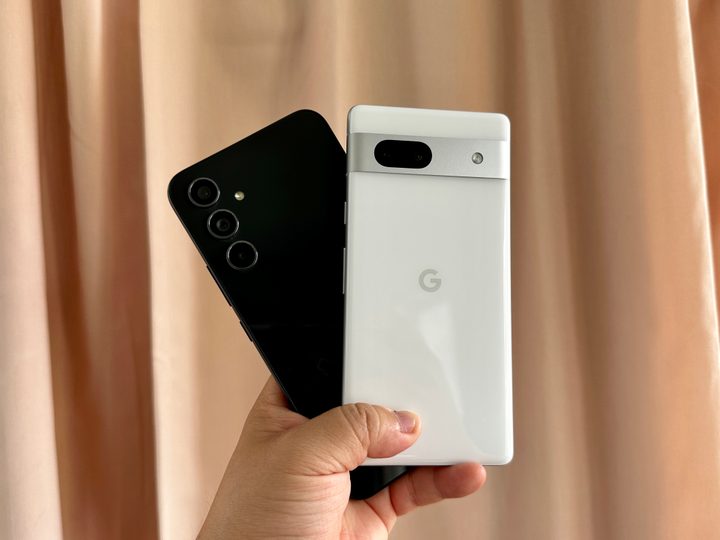 Google Pixel 7a and Samsung Galaxy A54 in hand