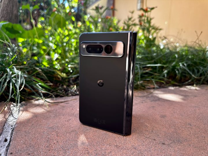 Google Pixel Fold in Obsidian open slightly on a planter.