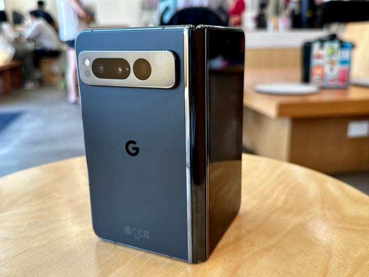 Google Pixel Fold in Obsidian open on a light wooden table.