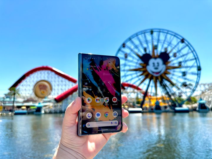 Google Pixel Fold in Obsidian held in hand showing home screen at Pixar Pier.