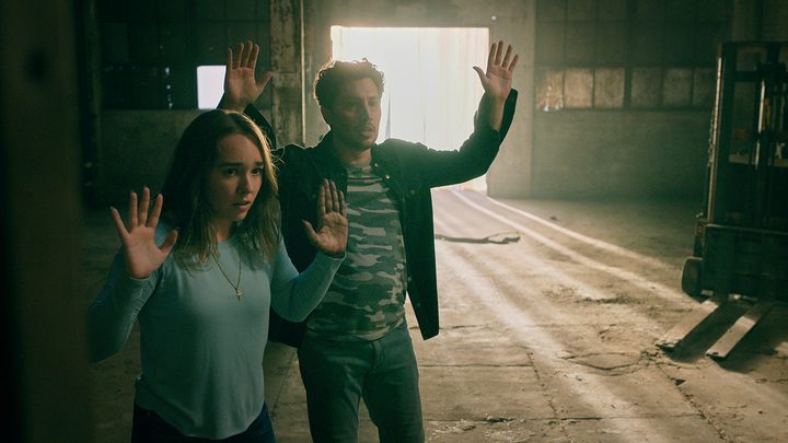 Angelina and Eagan with their hands in the air in a scene from Manifest.