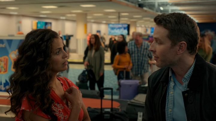 Grace and Ben in the airport in a scene from Manifest.
