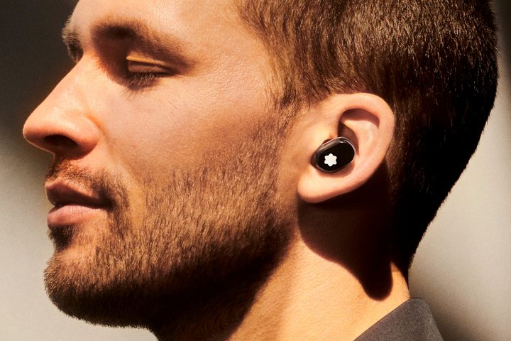 Man wearing Montblanc MTB 03 wireless earbuds.