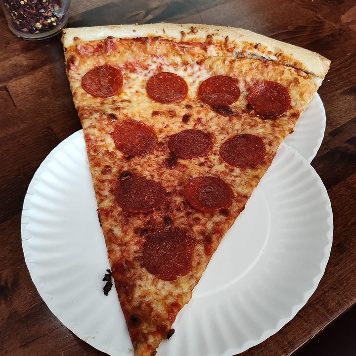 A large slice of pizza, taken with the Motorola Razr Plus.