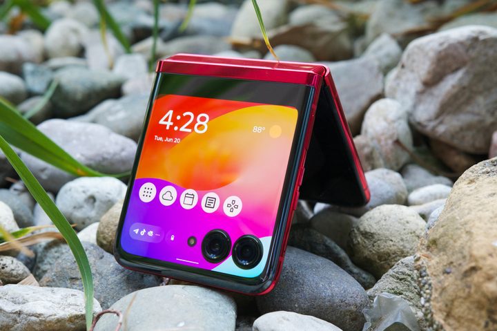 The Motorola Razr Plus, half folded with its cover screen on.