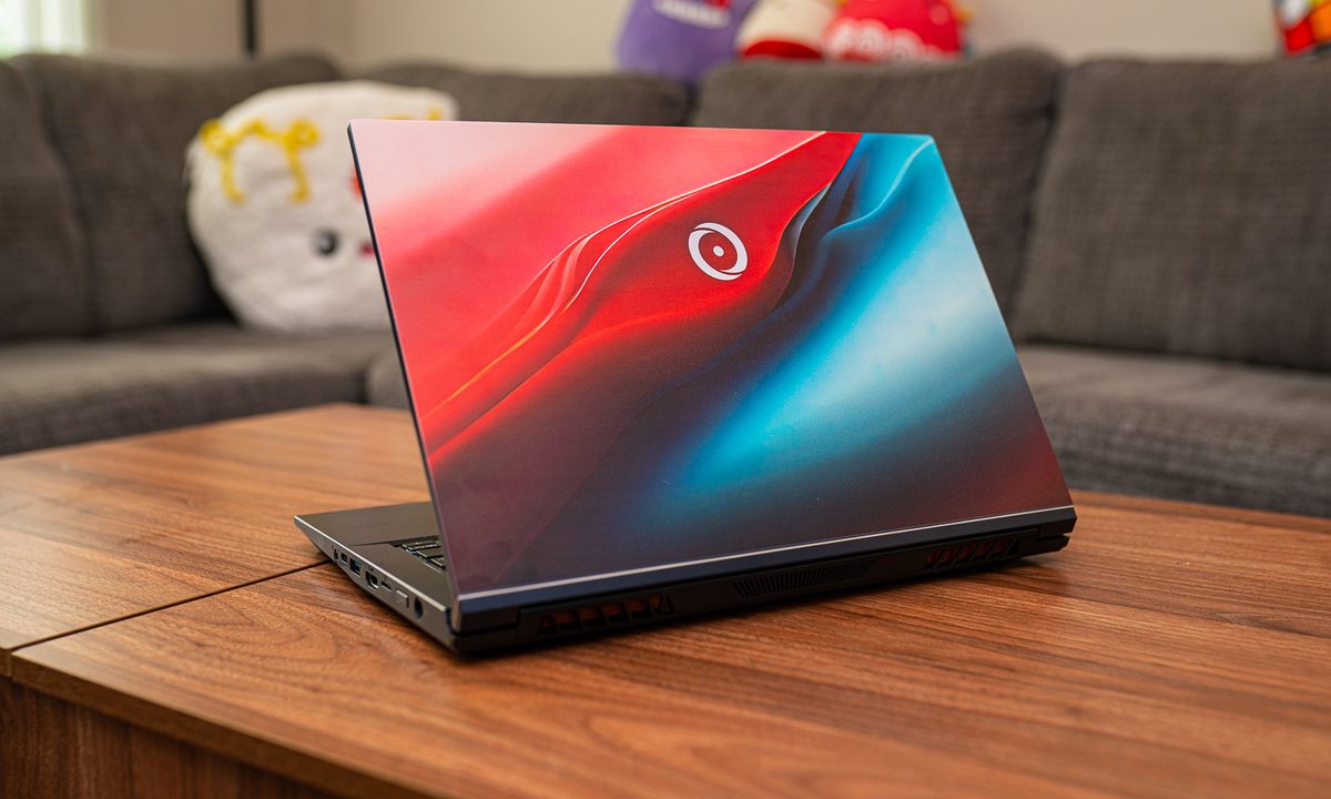 The Origin EON14-S sitting on a coffee table.