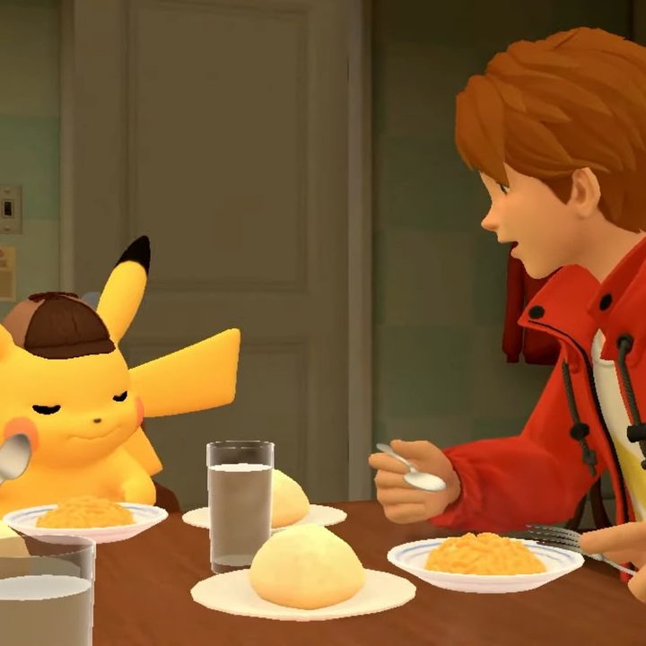 Pikachu with detective cap and boy with brown hair and red jacket eating breakfast