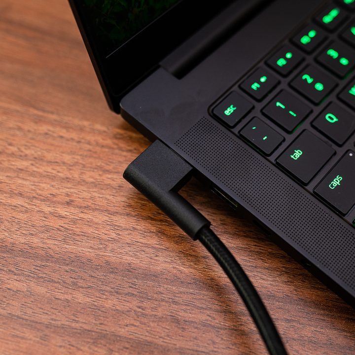The power adapter plugged into the Razer Blade 14.