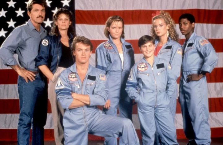The cast of SpaceCamp pose for a photo.
