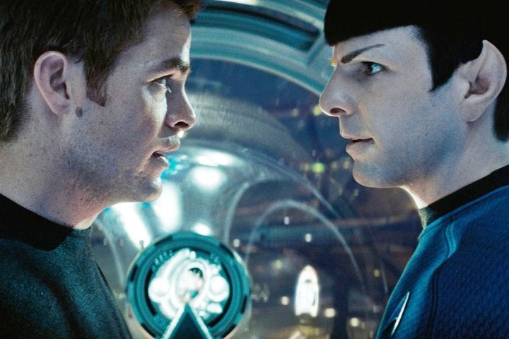Kirk and Spock look at each other in Star Trek.