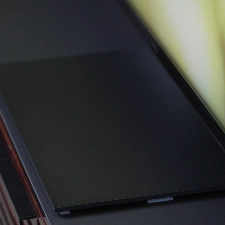 The center pedestal stand of a TCL QM8.