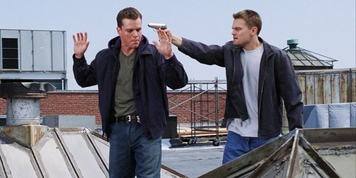A man aims a gun at another man in The Departed.