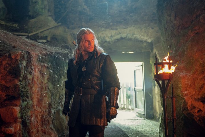 A man walks down a path in The Witcher season 3.