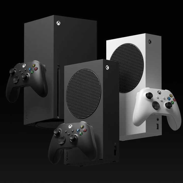 An Xbox Series X sits next to both Series S models.