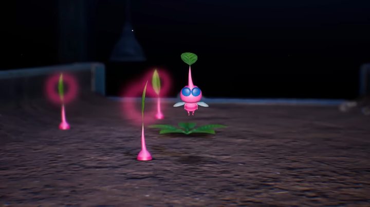 A pink pikmin flying by a flower.