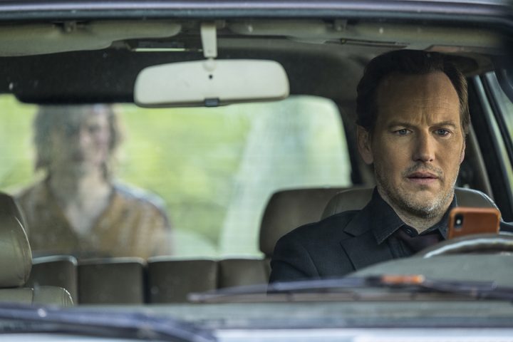 A ghost stands behind Patrick Wilson's car in Insidious: The Red Door.