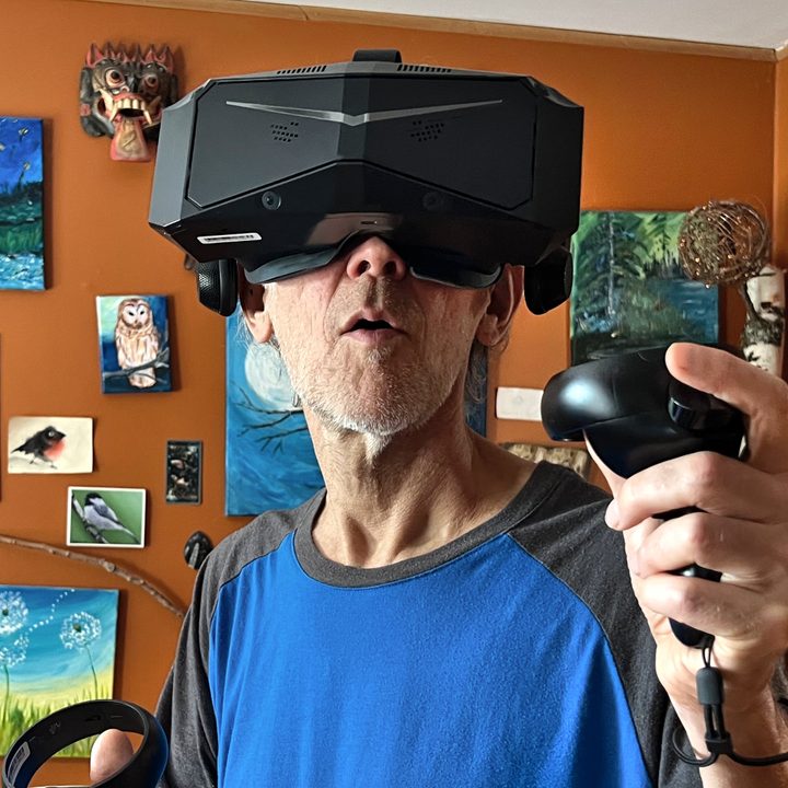 Alan Truly wears the Pimax Crystal, a premium VR headset with incredible sharpness.
