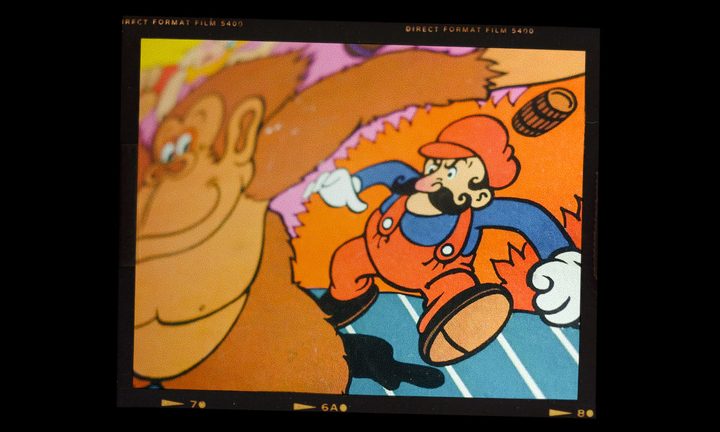 Mario lurks behind Donkey Kong.