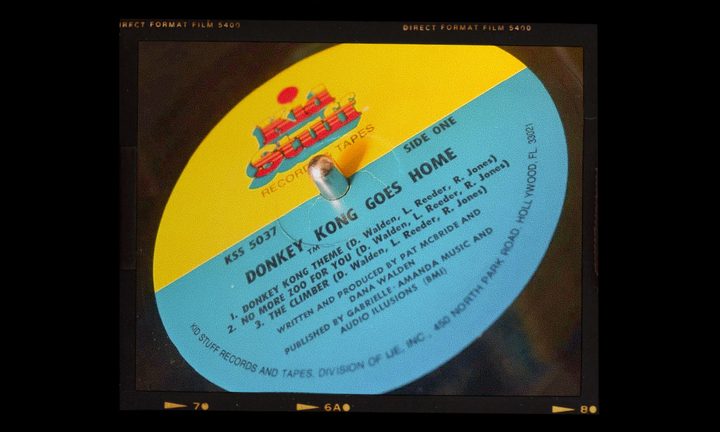 The Donkey Kong Goes Home vinyl record sits on a record player.