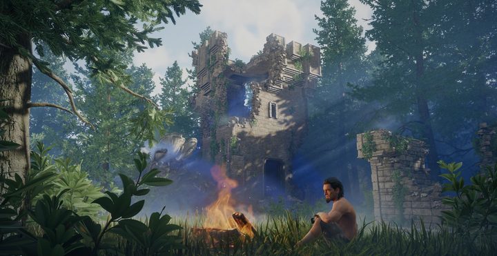 A player sits at a campfire in Enshrouded.