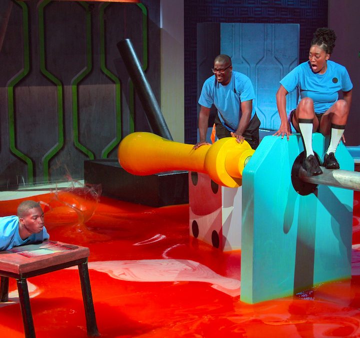 Three people stand on objects above the lava in Floor is Lava.