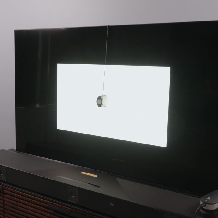 A brightness measurement being taken on the Hisense U8K TV.