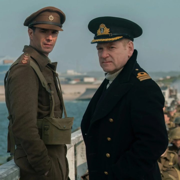 Kenneth Branagh and James D'Arcy stand on a pier together in Dunkirk.