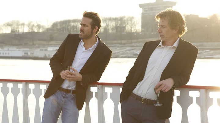 Two mean lean on a railing in Mississippi Grind.