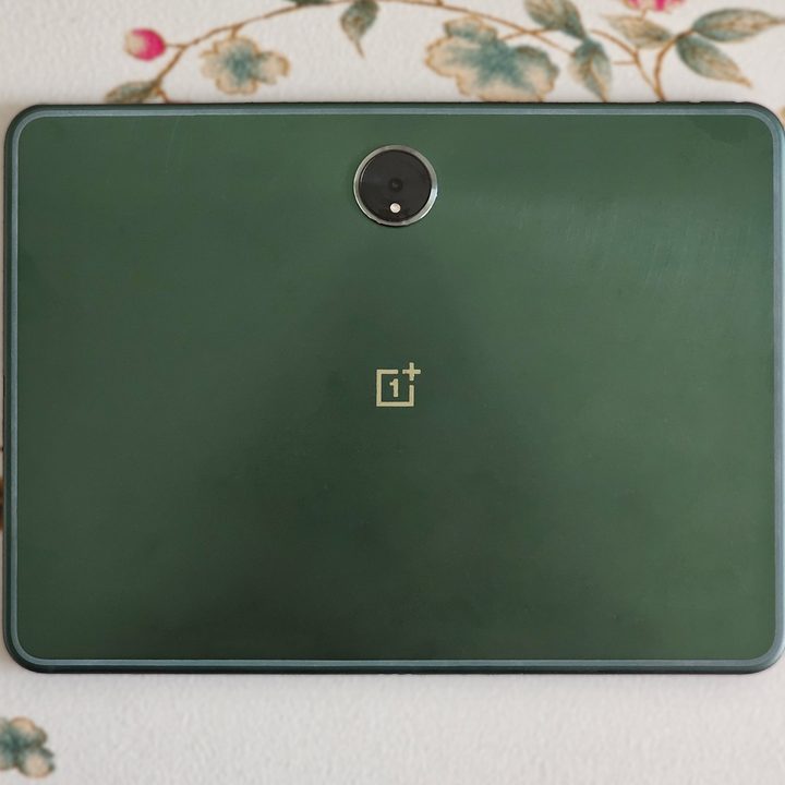 Green OnePlus Pad Android Tablet on a flat surface.