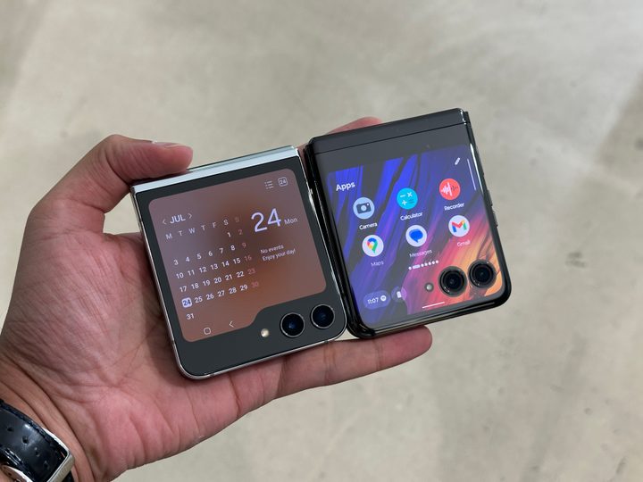 Samsung Galaxy Z Flip 5 and Motorola Razr Plus folded in hand.