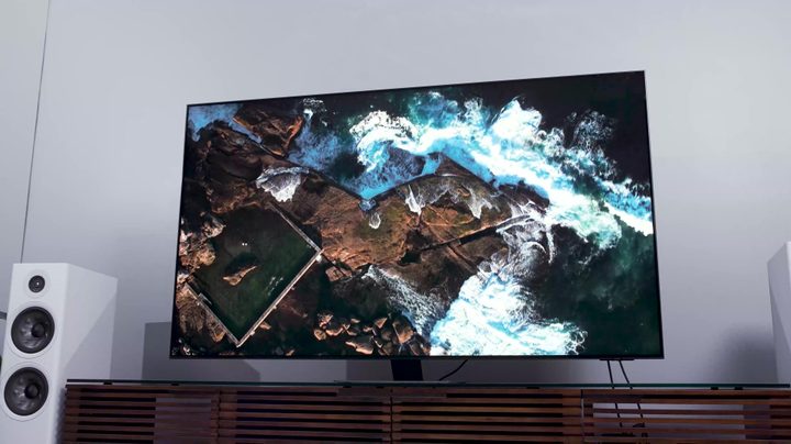 An aerial views of a coastline shown on a Samsung QN90C.