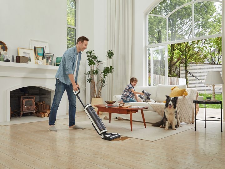 Tineco FLOOR ONE S3 Breeze cleaning a spill near family.