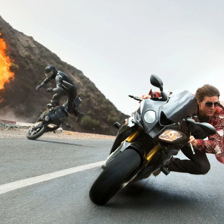 Tom Cruise drives a motorcycle in Rogue Nation.