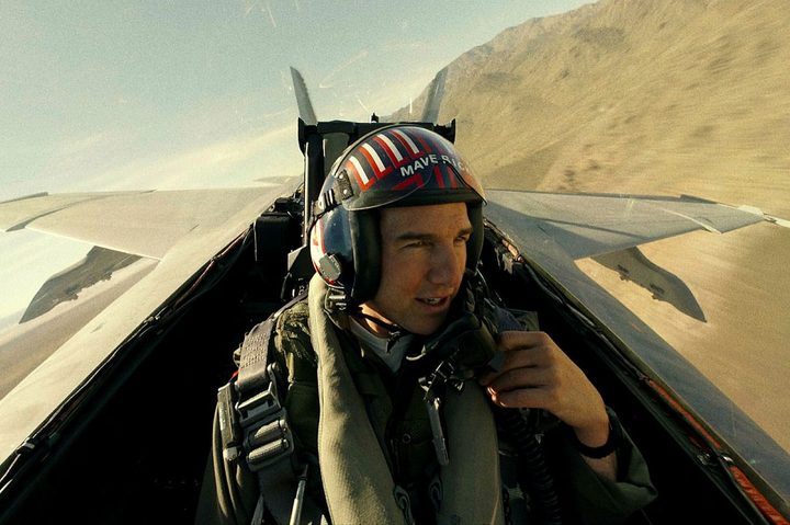 Tom Cruise flies a jet in Top Gun: Maverick.