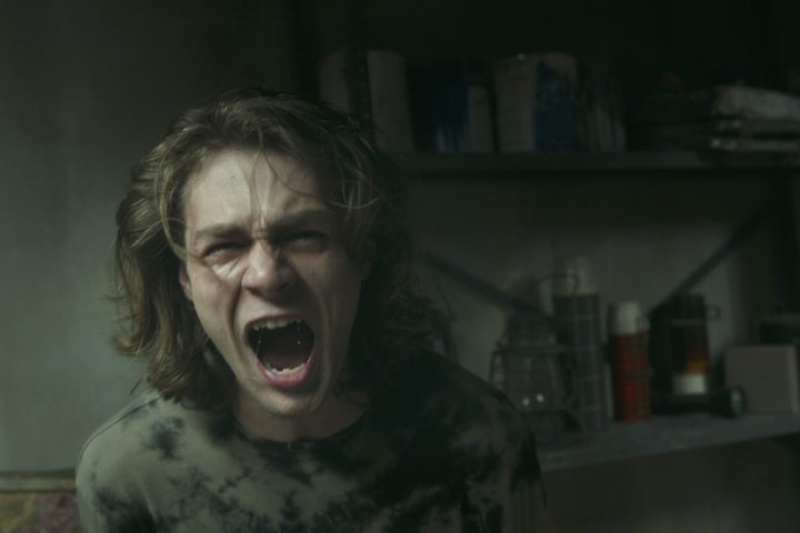 Ty Simpkins screams in Insidious: The Red Door.