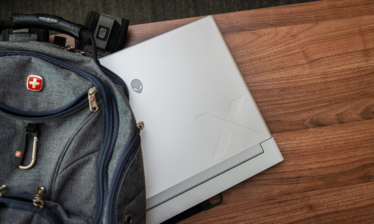 Alienware x16 hanging out of the backpack.
