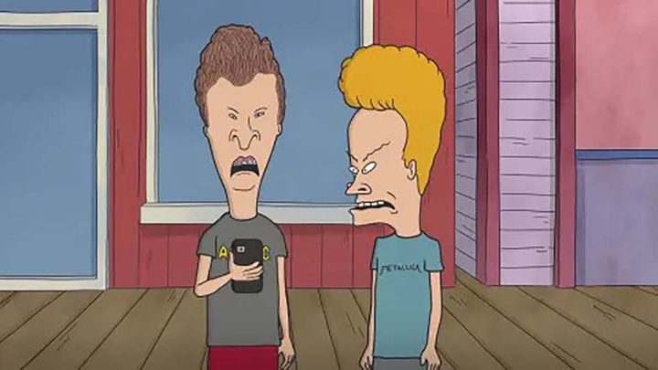 Beavis and Butt-Head looking at a phone in a scene from Beavis and Butt-Head.