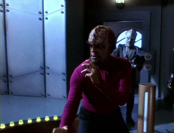 Worf in a fighting stance on the asteroid prison in "By Inferno's Light."