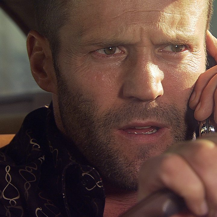 Jason Statham holds a cellphone to his ear in Crank.